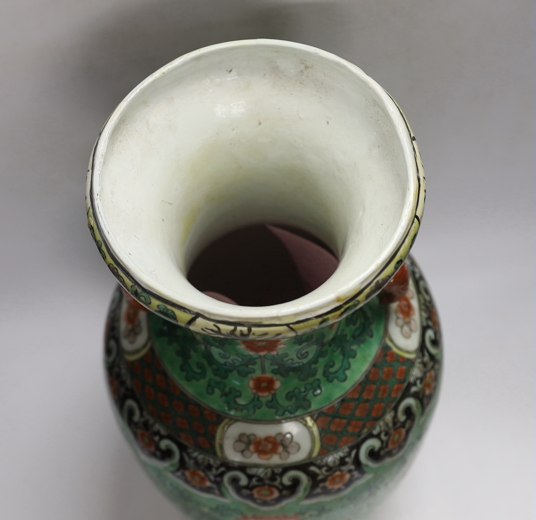 A Chinese green ground enamelled porcelain vase, Kangxi mark but late 19th century, 45cm